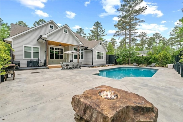 view of pool featuring a fenced backyard, a ceiling fan, a patio area, and a fenced in pool