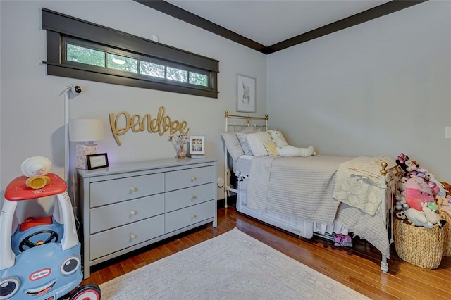 bedroom featuring wood finished floors