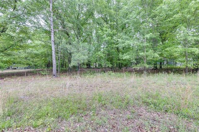 exterior space with a wooded view