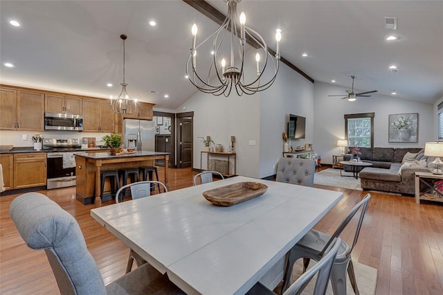 dining area featuring recessed lighting, hardwood / wood-style flooring, and ceiling fan with notable chandelier