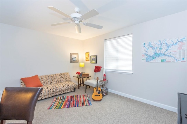 sitting room with carpet flooring, ceiling fan, and baseboards