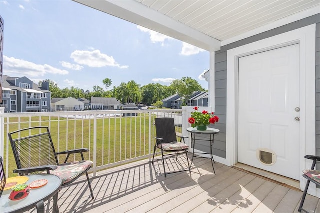 wooden deck with a yard