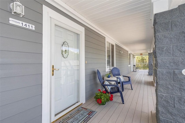 entrance to property featuring a porch