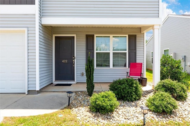 view of exterior entry with covered porch