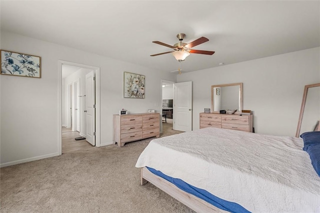 bedroom with baseboards, a ceiling fan, and light carpet