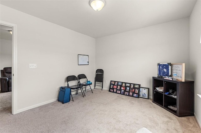 sitting room with carpet flooring and baseboards