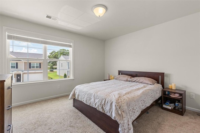 bedroom with visible vents, baseboards, and carpet floors