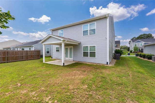 back of house with fence, a yard, a patio area, and central air condition unit