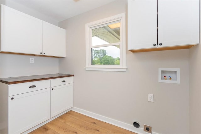 4082 Old Portman Rd, Anderson, SC 29626 - laundry area with hookup for an electric dryer, light wood finished floors, cabinet space, washer hookup, and baseboards