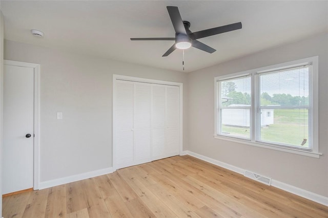 4082 Old Portman Rd, Anderson, SC 29626 - unfurnished bedroom with light wood-style floors, a closet, ceiling fan, baseboards, and visible vents