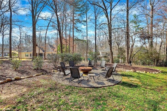 view of yard with an outdoor fire pit