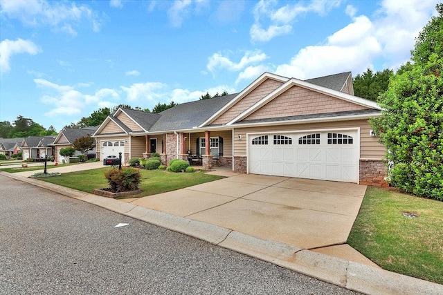 craftsman inspired home with a porch, a garage, driveway, and a front yard