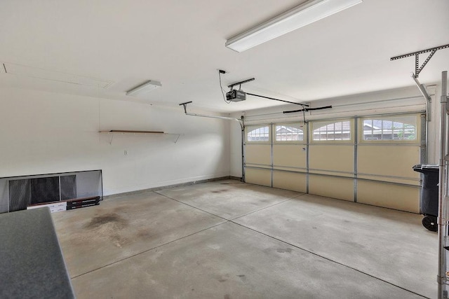 garage featuring baseboards and a garage door opener