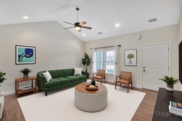 living area featuring visible vents, a ceiling fan, baseboards, and wood finished floors