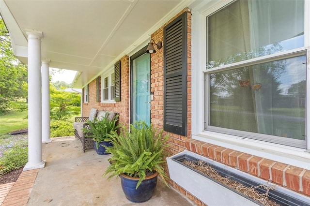 view of patio featuring a porch