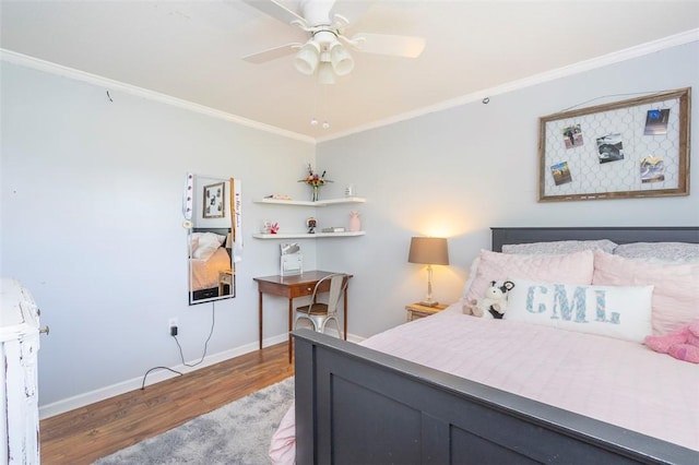 bedroom with baseboards, wood finished floors, ceiling fan, and ornamental molding