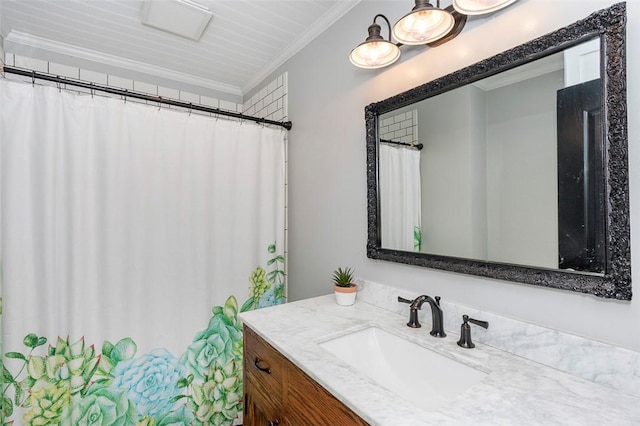full bathroom with ornamental molding and vanity