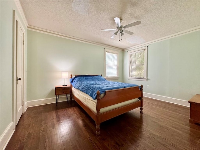 bedroom with dark wood-style floors, a ceiling fan, baseboards, ornamental molding, and a textured ceiling