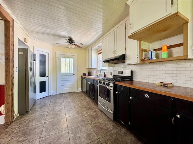 kitchen featuring dark cabinets, appliances with stainless steel finishes, under cabinet range hood, and decorative backsplash