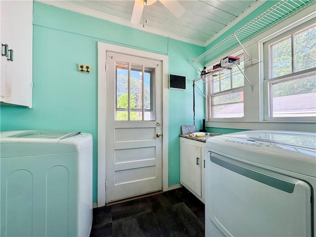 laundry area featuring dark wood finished floors, washer and dryer, a ceiling fan, and cabinet space