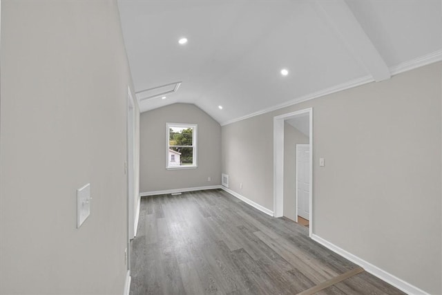 bonus room featuring visible vents, baseboards, recessed lighting, vaulted ceiling, and wood finished floors