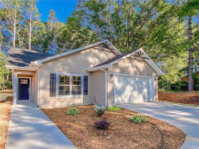 view of front facade featuring concrete driveway and an attached garage