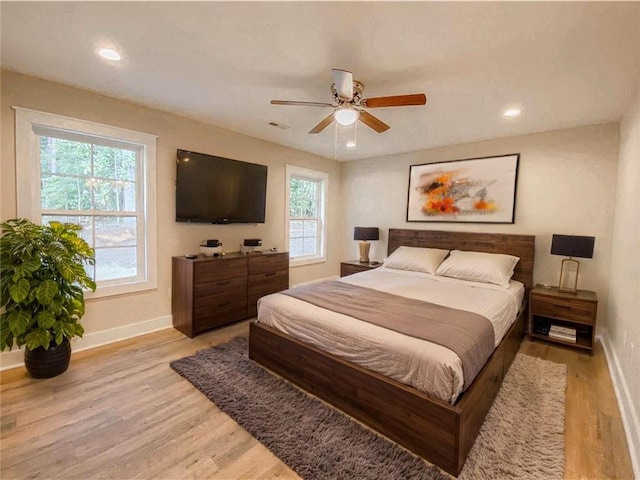 bedroom with recessed lighting, baseboards, ceiling fan, and light wood-type flooring