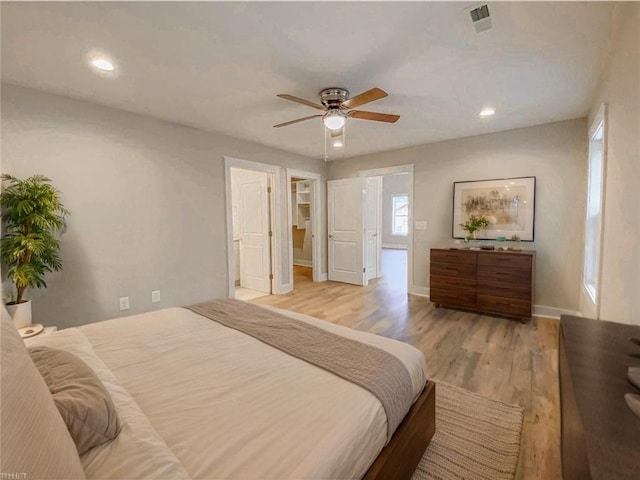 bedroom with light wood-style floors, baseboards, recessed lighting, and visible vents