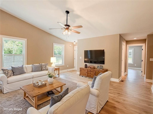 320 Code Cir, Seneca, SC 29678 - living room featuring light wood finished floors, ceiling fan, vaulted ceiling, and baseboards