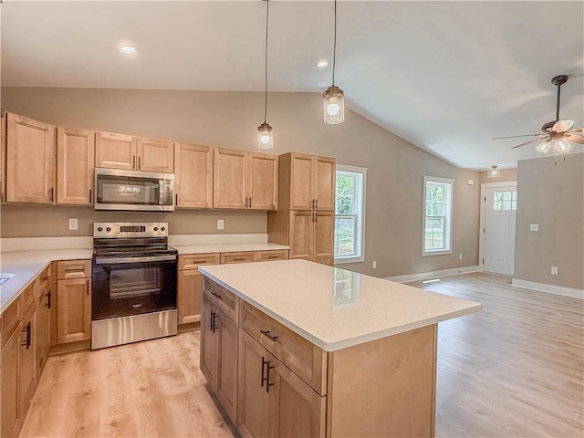 320 Code Cir, Seneca, SC 29678 - kitchen featuring stainless steel appliances, lofted ceiling, light wood-style floors, light countertops, and light brown cabinetry
