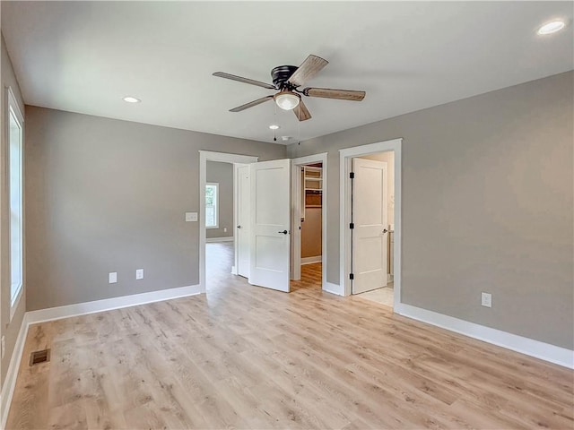 320 Code Cir, Seneca, SC 29678 - unfurnished bedroom featuring baseboards, recessed lighting, light wood-type flooring, a spacious closet, and a ceiling fan