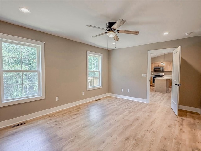 320 Code Cir, Seneca, SC 29678 - unfurnished room featuring healthy amount of natural light, a ceiling fan, baseboards, light wood finished floors, and recessed lighting