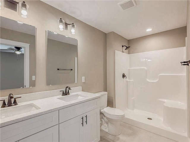 320 Code Cir, Seneca, SC 29678 - full bathroom featuring a ceiling fan, toilet, a shower, and double vanity