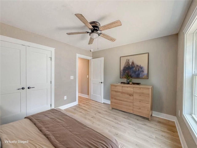 320 Code Cir, Seneca, SC 29678 - bedroom with light wood finished floors, baseboards, a ceiling fan, and a closet