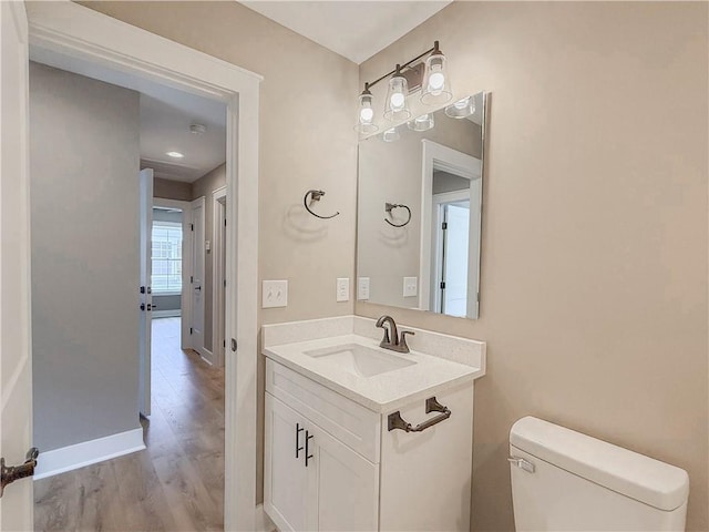 320 Code Cir, Seneca, SC 29678 - bathroom with toilet, vanity, wood finished floors, and baseboards