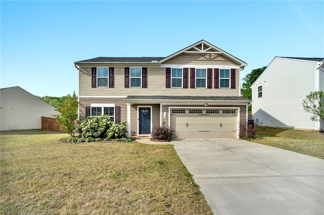 view of front facade featuring a garage, fence, a front yard, and concrete driveway