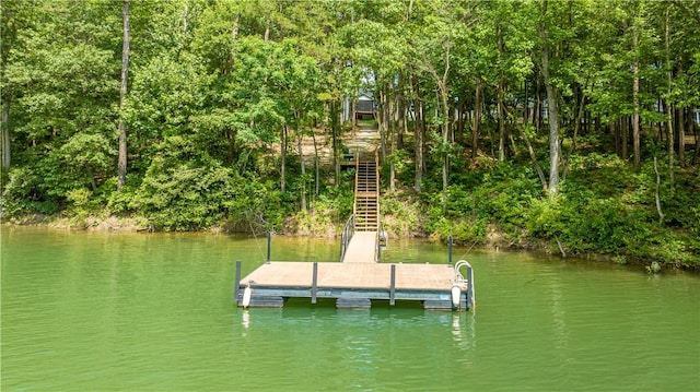 dock area featuring stairs and a water view
