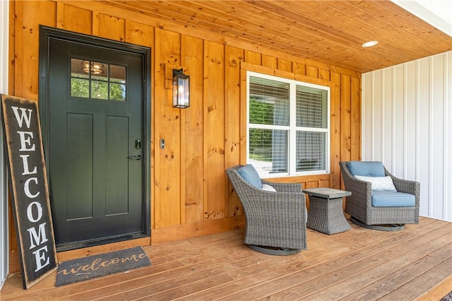 doorway to property featuring board and batten siding and a porch