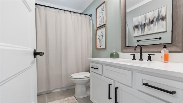 bathroom featuring vanity, tile patterned floors, toilet, and curtained shower