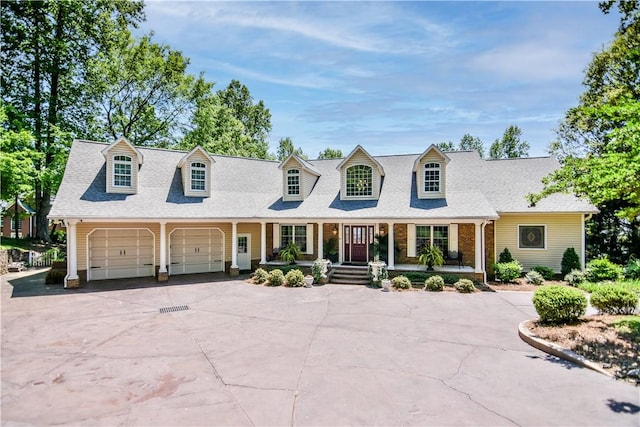 515 Beacon Shores Dr, Seneca, SC 29672 - new england style home with a porch, driveway, an attached garage, and roof with shingles