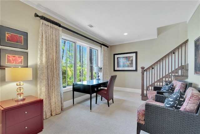 office with visible vents, ornamental molding, baseboards, and light carpet