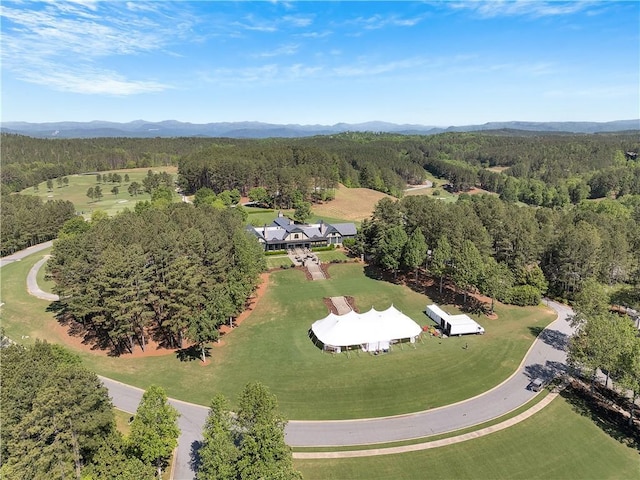 aerial view featuring a mountain view and a forest view