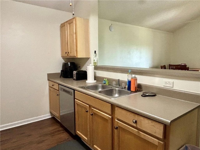 kitchen with a sink, dishwasher, light countertops, dark wood finished floors, and baseboards