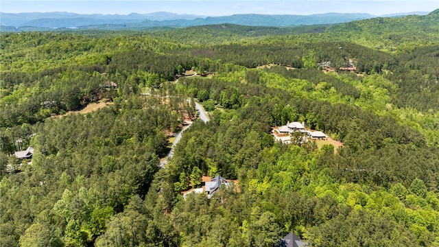 aerial view featuring a mountain view and a wooded view