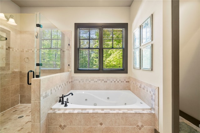 bathroom with a whirlpool tub and a stall shower