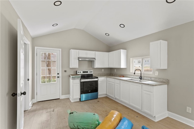 kitchen featuring vaulted ceiling, a sink, light wood finished floors, stainless steel electric stove, and under cabinet range hood