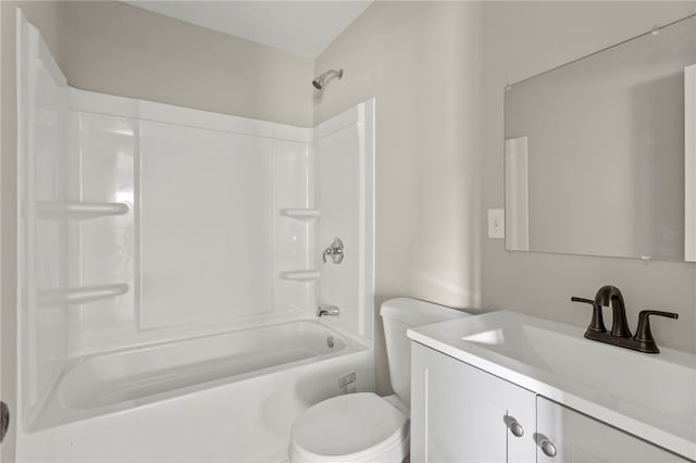 bathroom with vanity, shower / bathing tub combination, and toilet