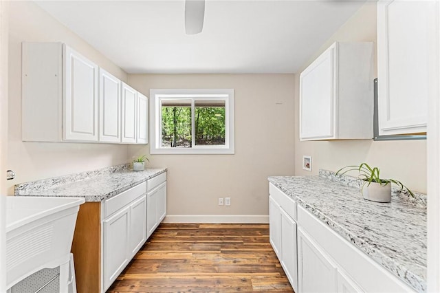 243 Beaver Lodge Rd, Hartwell, GA 30643 - washroom featuring cabinet space, baseboards, wood finished floors, and washer hookup