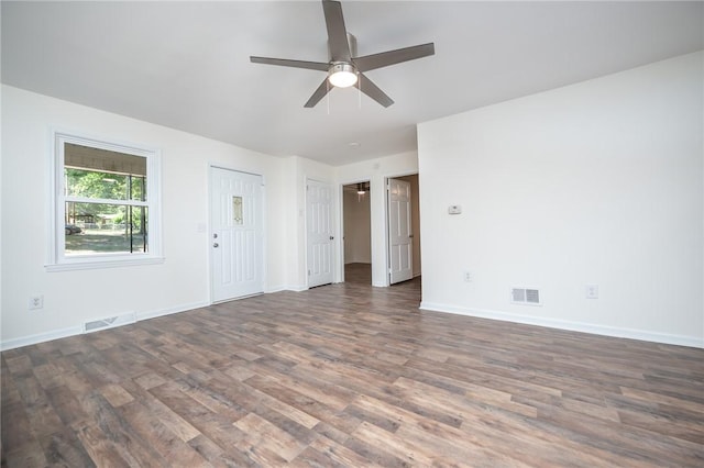 unfurnished living room featuring baseboards, ceiling fan, wood finished floors, and visible vents