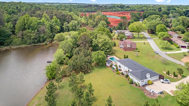 bird's eye view featuring a water view and a wooded view